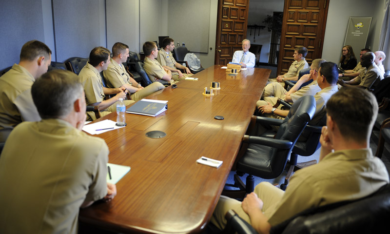 Chief of Naval Operations Strategic Studies Group (CNO SSG) Director retired Adm. James Hogg, center, addresses the NPS contingent of Director Fellows for CNO SSG XXXII on the day of their final selection for the fellowship.