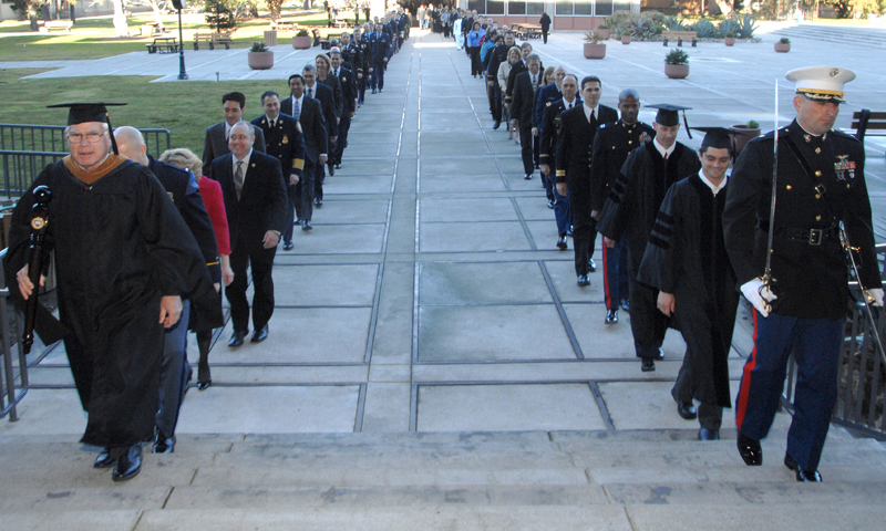 Graduates cross Spruance Plaza during the graduation procession for the Fall Quarter commencement ceremonies, Dec. 16. A total of 365 students earned advanced degrees during this quarter’s ceremony.