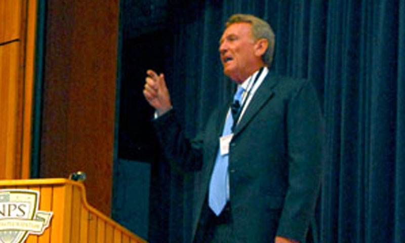 Retired Adm. Harry Ulrich, Former Commander of U.S. Naval Forces Europe, offers opening remarks at the 9th International Symposium on Technology and the Mine Problem. Ulrich joined several hundred students, scholars and professionals for the three-day event, looking at unmanned systems and sea mine technology.