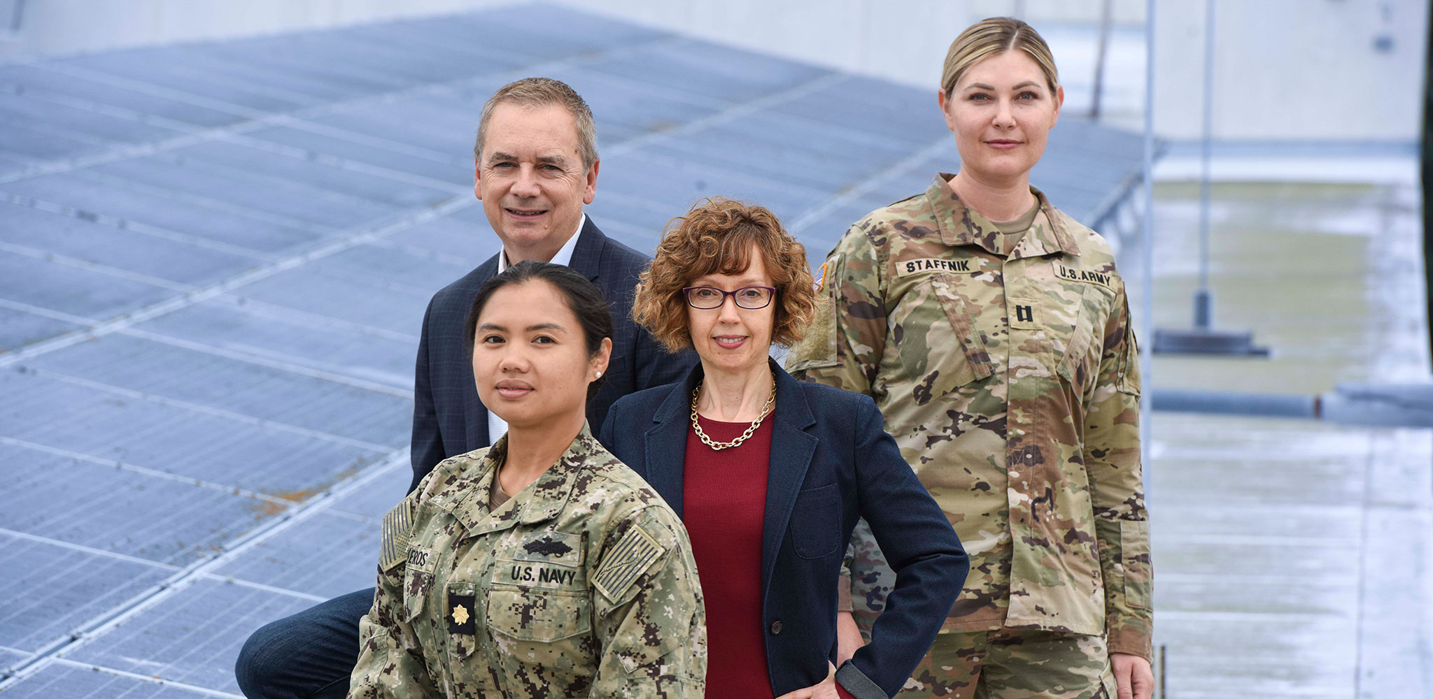 NPS Professor Dr. Giovanna Oritistands with team members U.S. Navy Lt. Cmdr. Olive Oliveros, NPS Professor Dr. Ron Giachetti and U.S. Army Capt. Abigail Staffnik.