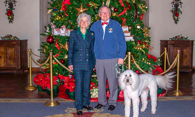 Holiday picture with Vice Adm. Ann E. Rondeau, U.S. Navy (ret.), her husband John and their dog Buddy.