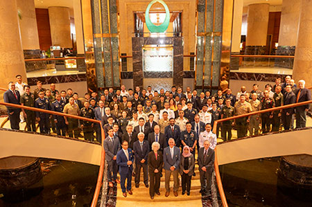 Group photograph of attendees at Naval Postgraduate School Regional Alumni Symposium in Singapore.