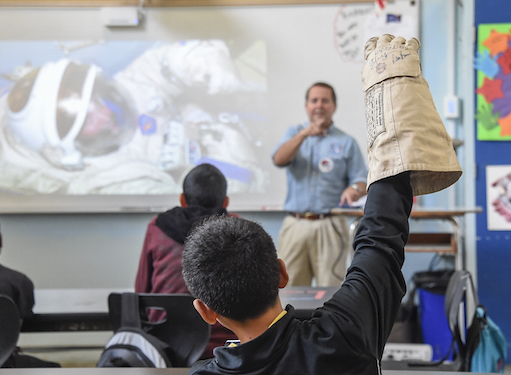 Astronaut Dan Bursch speaking with middle schoolers