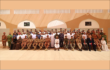 Large group of people of Oman pose for a group photo.