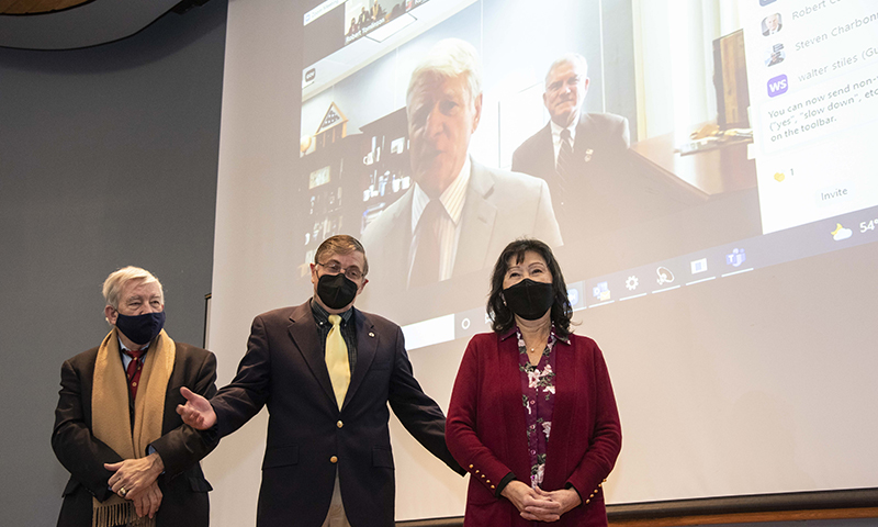 Members of the Naval War College, College of Distance Education program at NPS, from left, Dr. Mitch Brown, Associate Dean Fred Drake and Academic Coordinator Rose Drake, are recognized for their combined 60-years of contributions to the long-running partnership with NPS during a virtual meeting with NWC officials.