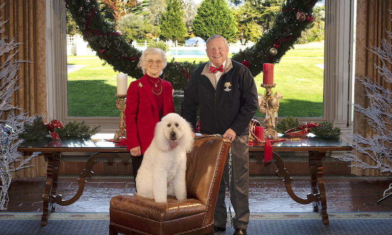 Holiday picture with Vice Adm. Ann E. Rondeau, U.S. Navy (ret.), her husband John and their dog Buddy.
