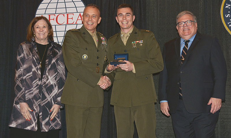 U.S. Marine Corps Capt. Thomas Schmitt receiving the 2023 Copernicus Award from Lt. Gen. Matthew Glavy