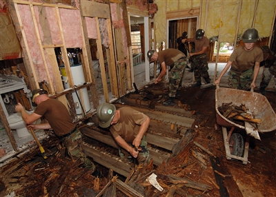 Navy Seabees tear down plywood